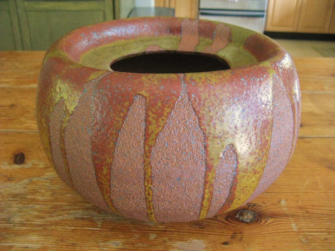 Two bowls made from red stoneware clay glazed is a glowing speckled orange.  : r/Pottery